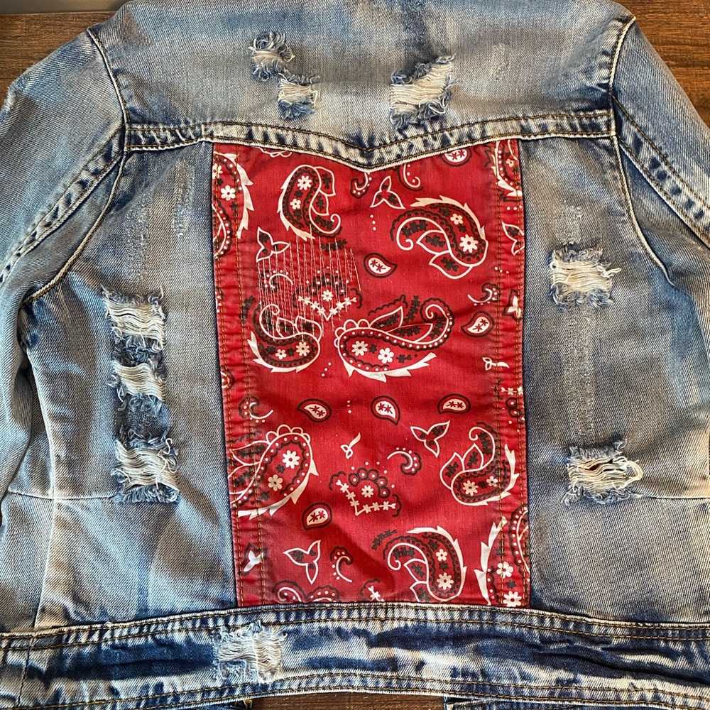 White crow bandana back distressed denim jacket. Purchased at the Buckle.